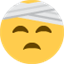 Émoji face with head-bandage