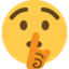Émoji face with finger covering closed lips