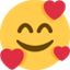 Émoji smiling face with smiling eyes and three hearts