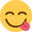 Émoji face savouring delicious food
